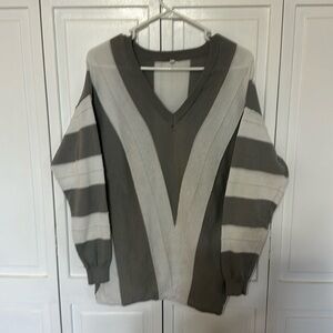 Women’s gray and white V-neck sweater